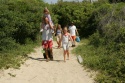 a-family-heads-towards-the-beach_w725_h483.jpg